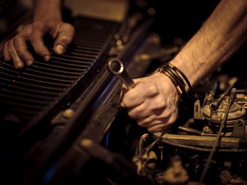 Mechanic diagnosing CVT and automatic transmission fault in Dhaka garage