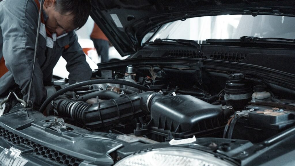 Mechanic inspecting a used car before purchase in Dhaka
