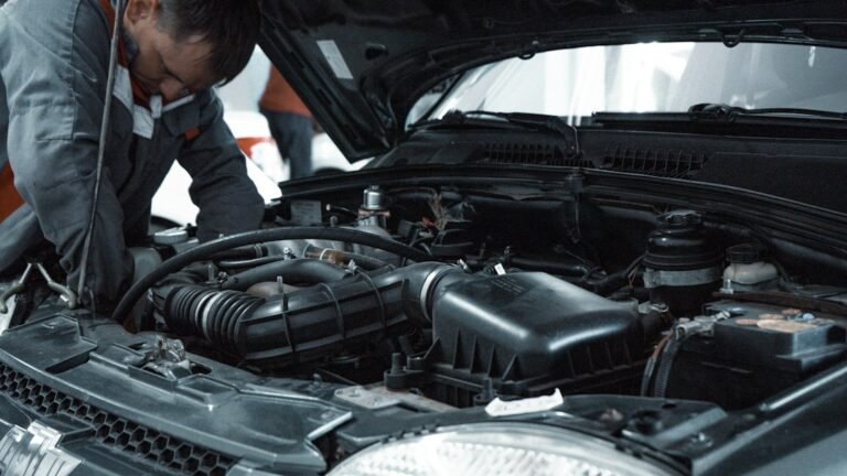 Mechanic inspecting a used car before purchase in Dhaka