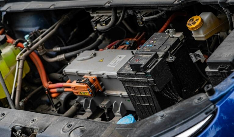 Technician servicing a Toyota hybrid battery pack